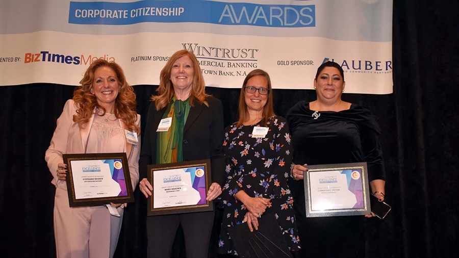 Marci Boucher second from left accepting award as nonprofit executive of the year