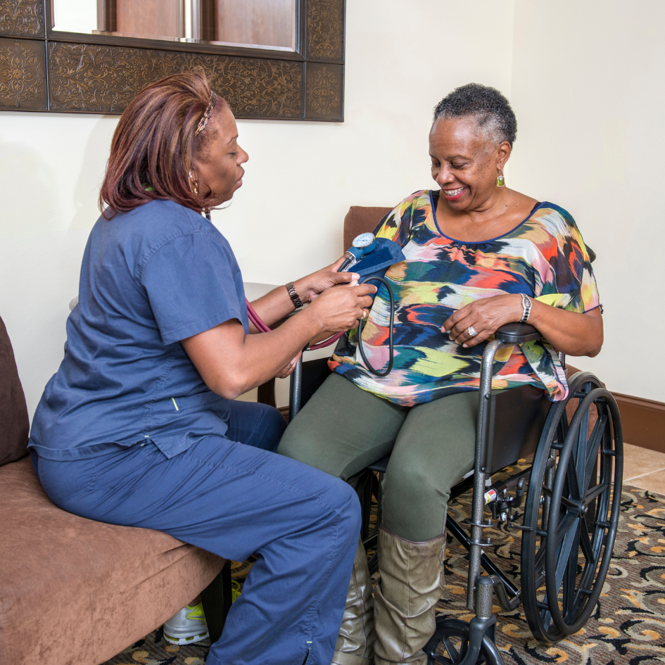 photo of a nurse caring for a person using a wheelchair